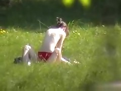 A creeper in the bushes catches a nude couple fucking in the park with his cam. Their nude bodies get it on and enjoy their sex without a care in the world or the slightest suspicion that someone may be lurking.
