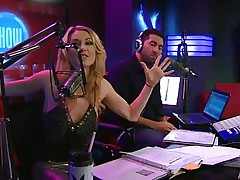 Playboy Radio's Morning Show has some of the hottest women you've ever seen! They're talking about Halloween costumes, and their guest has a cop outfit on that looks hot as hell. It gets even sexier when her top comes off, baring her tits. The female host comes over and helps shorten the skirt.